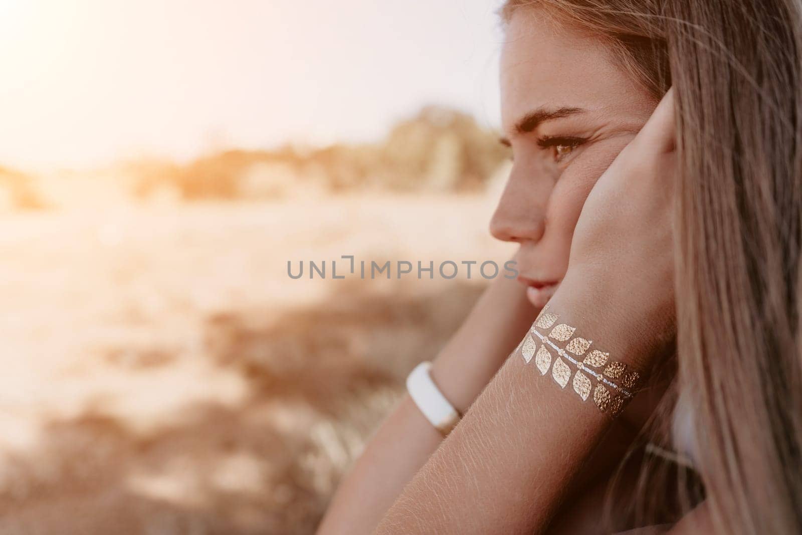 Woman summer travel sea. Happy tourist in hat enjoy taking picture outdoors for memories. Woman traveler posing on the beach at sea surrounded by volcanic mountains, sharing travel adventure journey by panophotograph