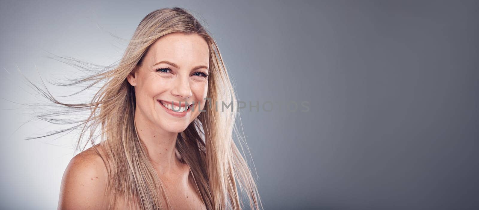 Beauty, hair care and woman portrait with space for mockup in studio with natural makeup cosmetics. Face of aesthetic model person on a grey background for hairdresser or salon shampoo for shine.