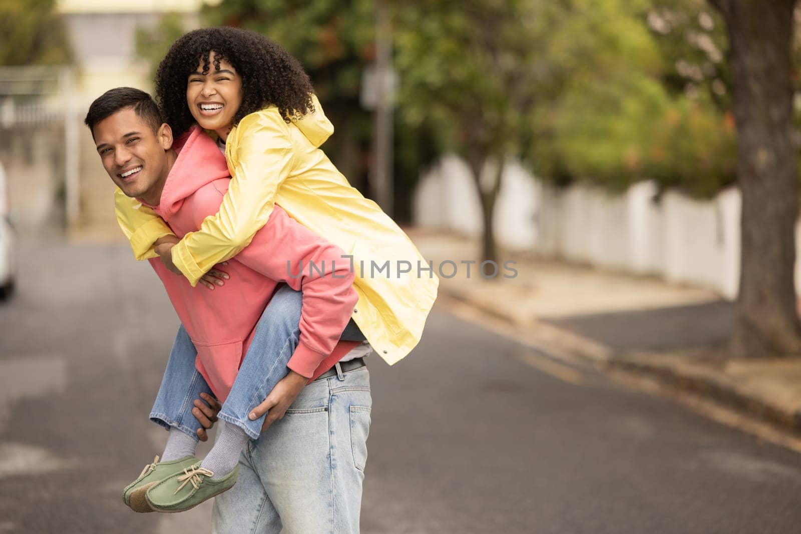 Black couple, piggyback and portrait of young people with love, care and bonding in a street. Urban, happy and black woman and man together with a smile and happiness loving summer fun outdoor.