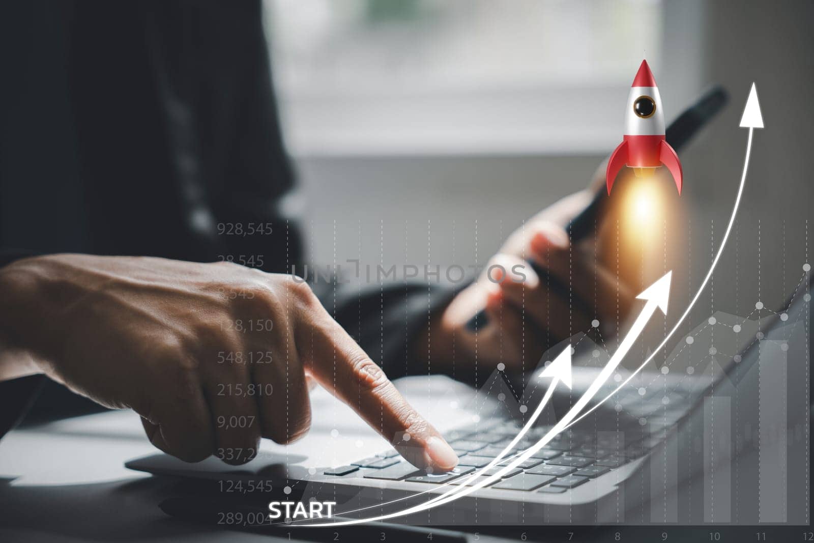 Business startup concept with a rocket icon launching from a laptop by Sorapop