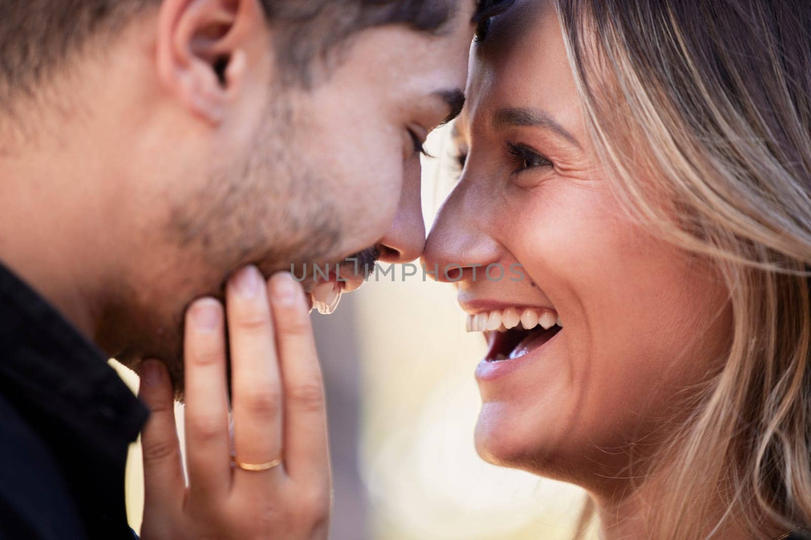 Couple, forehead touch and laugh together with happiness, comic moment or romance outdoor for date. Man, woman and funny time with love, care or happy in nature closeup with hand, face and crazy joke by YuriArcurs