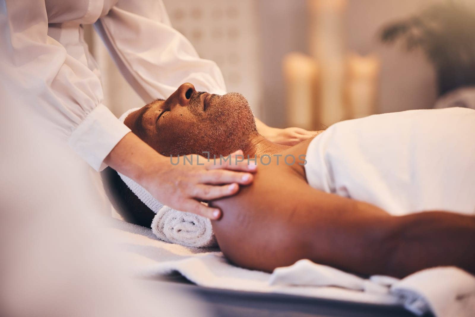 Spa, physiotherapy or hands massage old man to relax the body, mind or shoulders on a physical therapy table. Luxury, peace and zen masseuse helping a senior or elderly client with stress relief by YuriArcurs