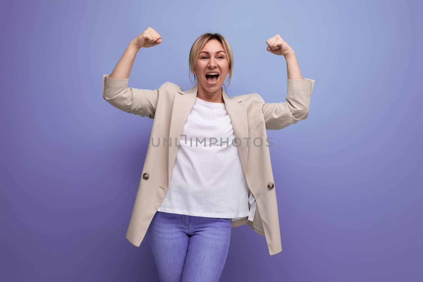 portrait of strong successful blonde 30s business woman on studio background by TRMK