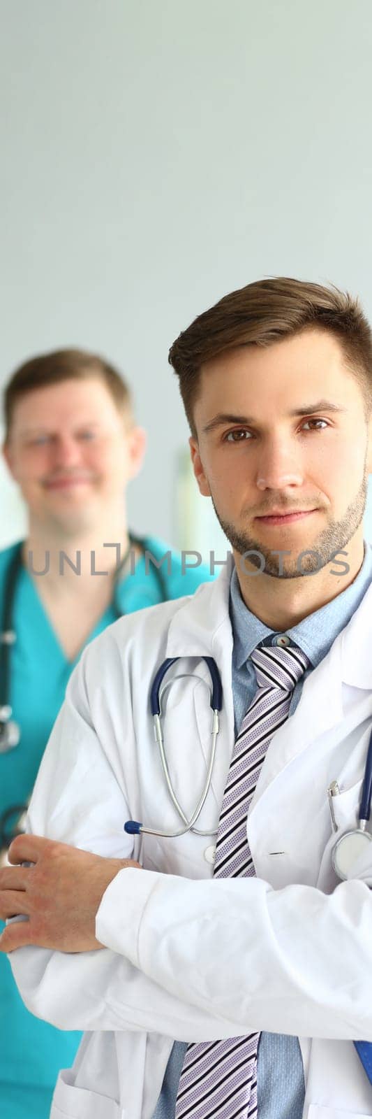 Portrait of two men in healthcare profession. Team of cardiologists therapists or surgeons