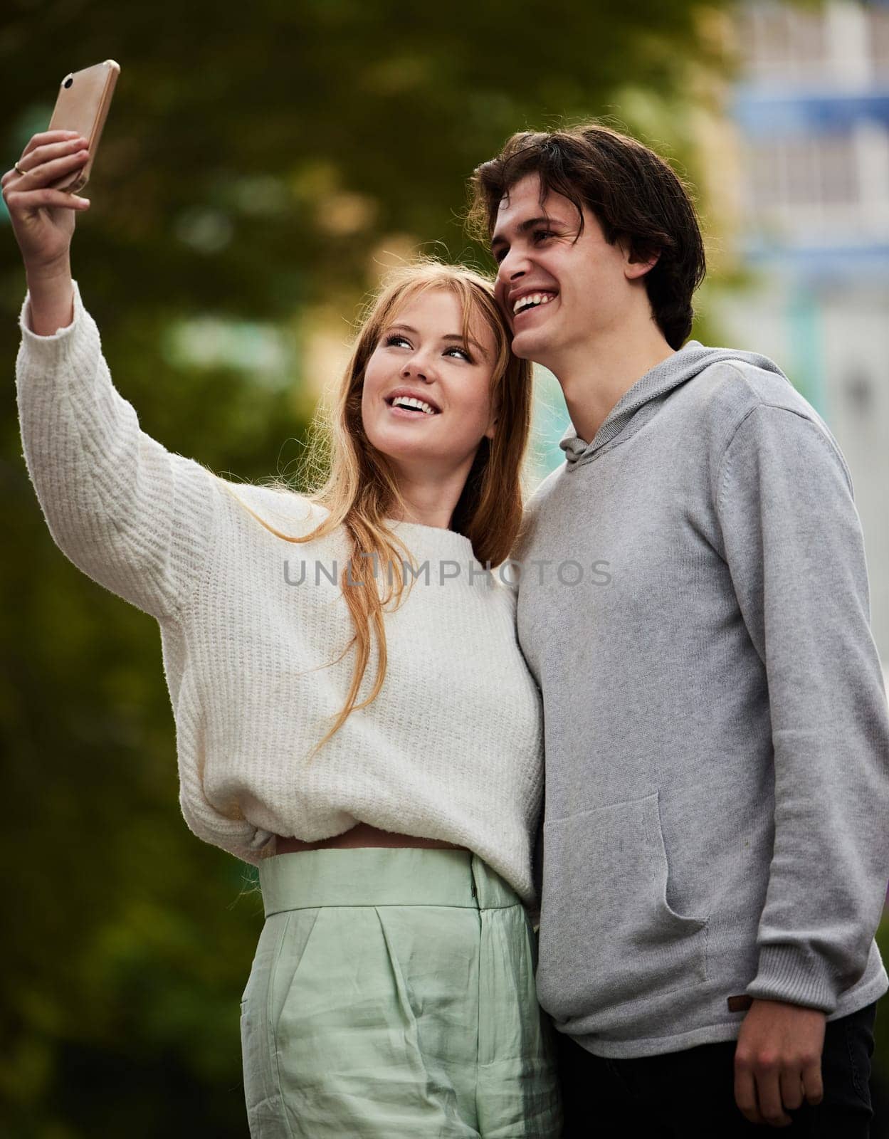 Selfie, happy and couple bonding in the city for memory, travel and on holiday together. Smile, date and woman taking a photo with a man on a vacation in an urban town for quality time and a break.