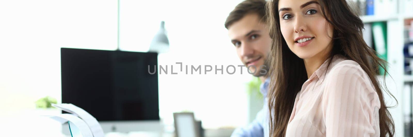 Man and a woman are learning to play synthesizer at home by kuprevich