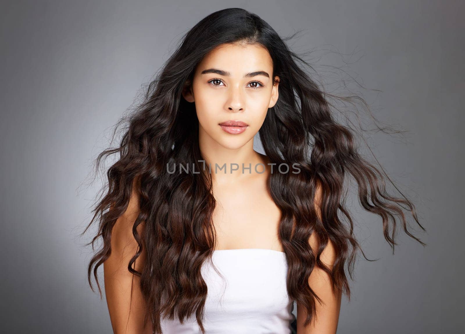 Hair, hair care and woman, face and beauty, glow and shine with keratin treatment. Cosmetic mockup, waves and texture with hair style with studio background. Wellness, self care portrait and growth