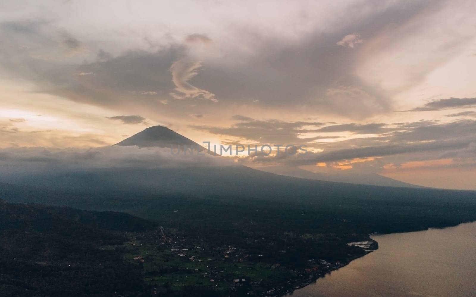 Sunset aerial view of Agung volcano in Bali, Indonesia by Popov