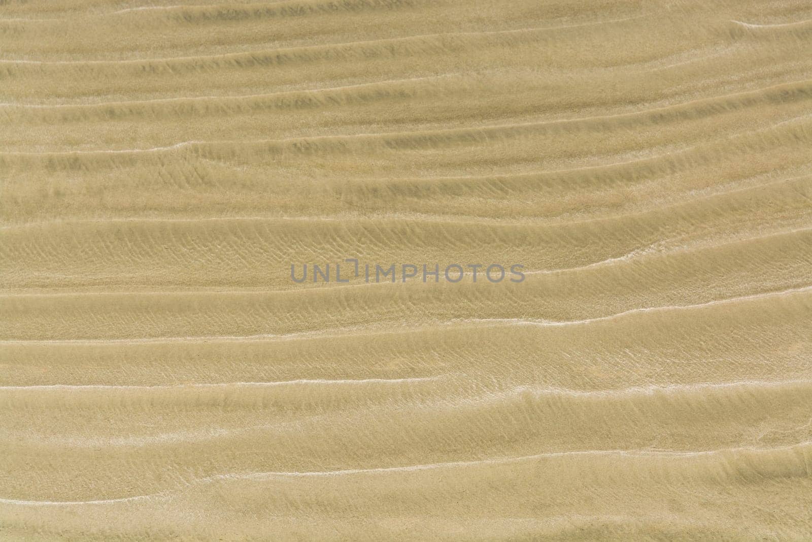 Waves of sand on one of Pacific ocean beaches by Imagenet