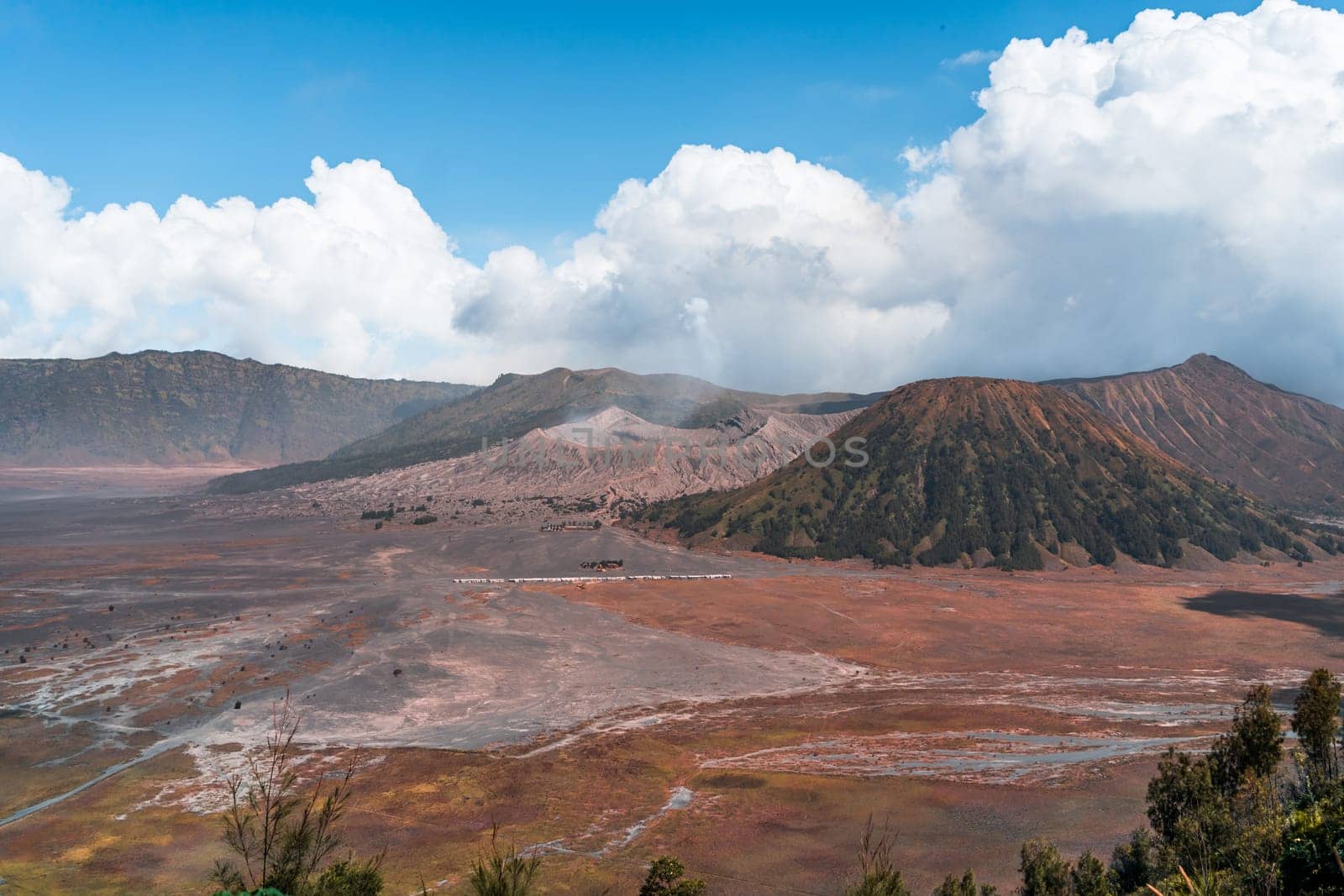 Landscape view of bromo volcano with cloudy sky by Popov