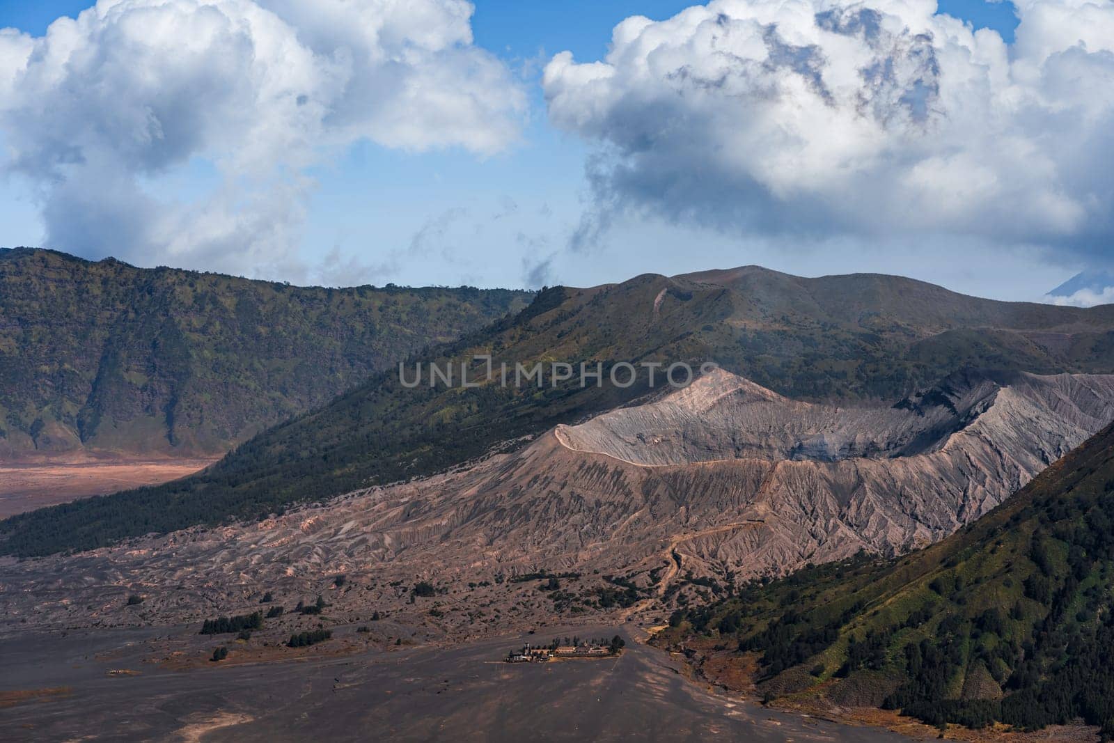 Landscape view of mount Bromo with cloudy sky by Popov