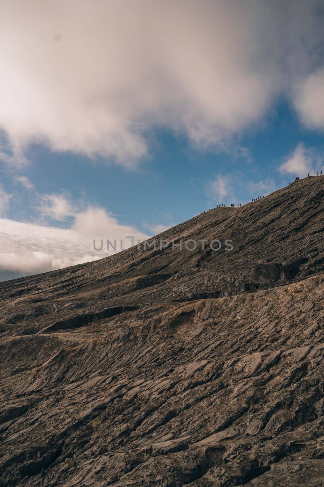 Mount Bromo volcano dry lava texture. Semeru mountain and volcanic landscape view