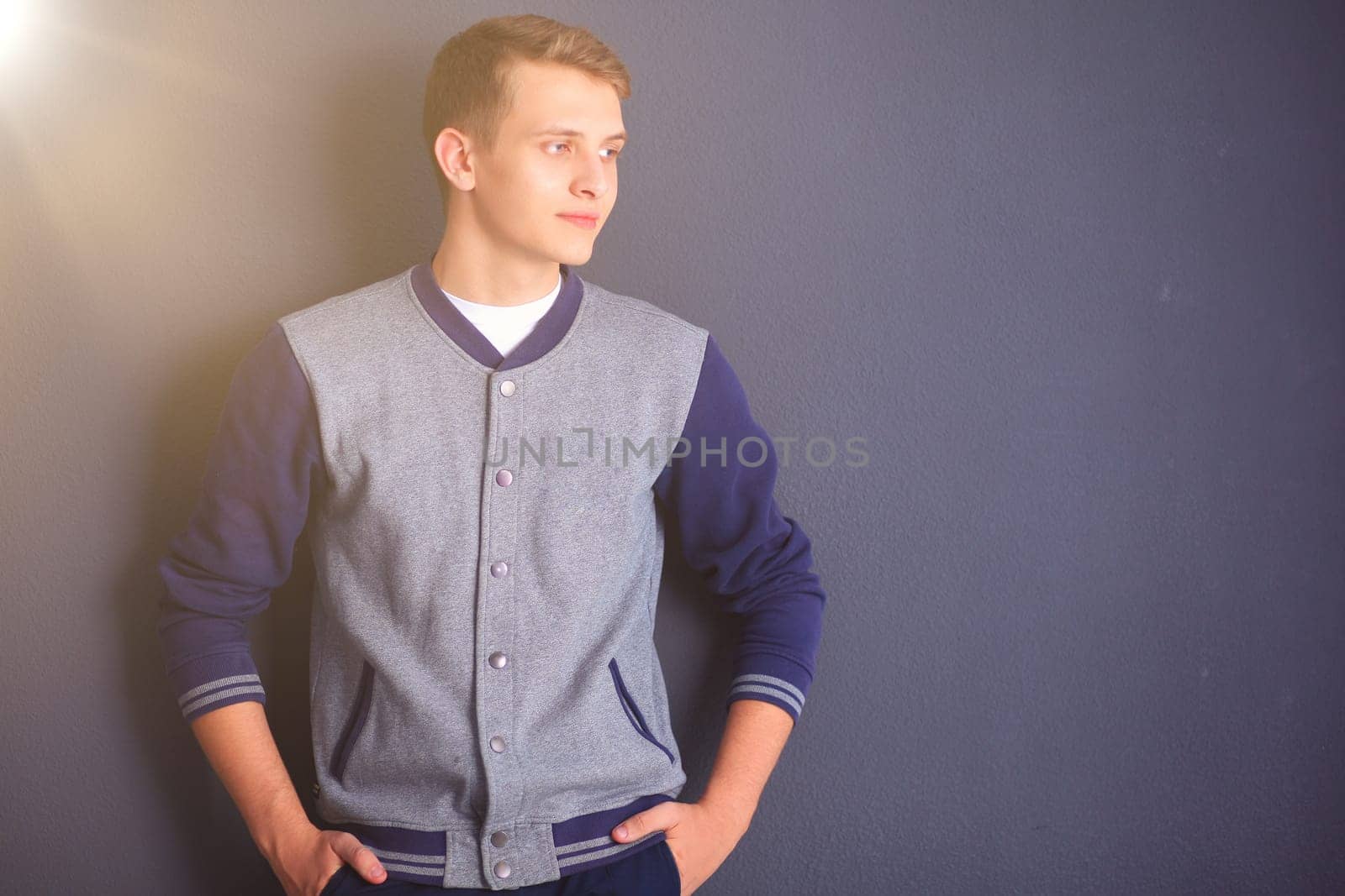 portrait of a young man on black background