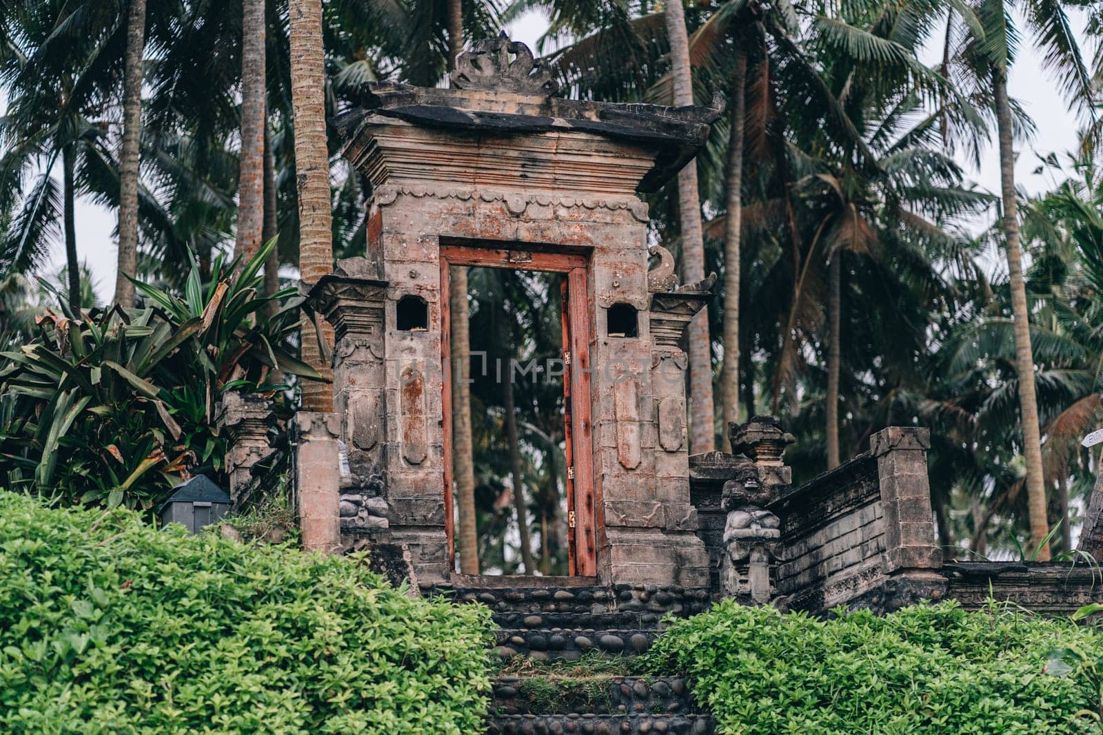 Stone temple gates in tropical jungle by Popov