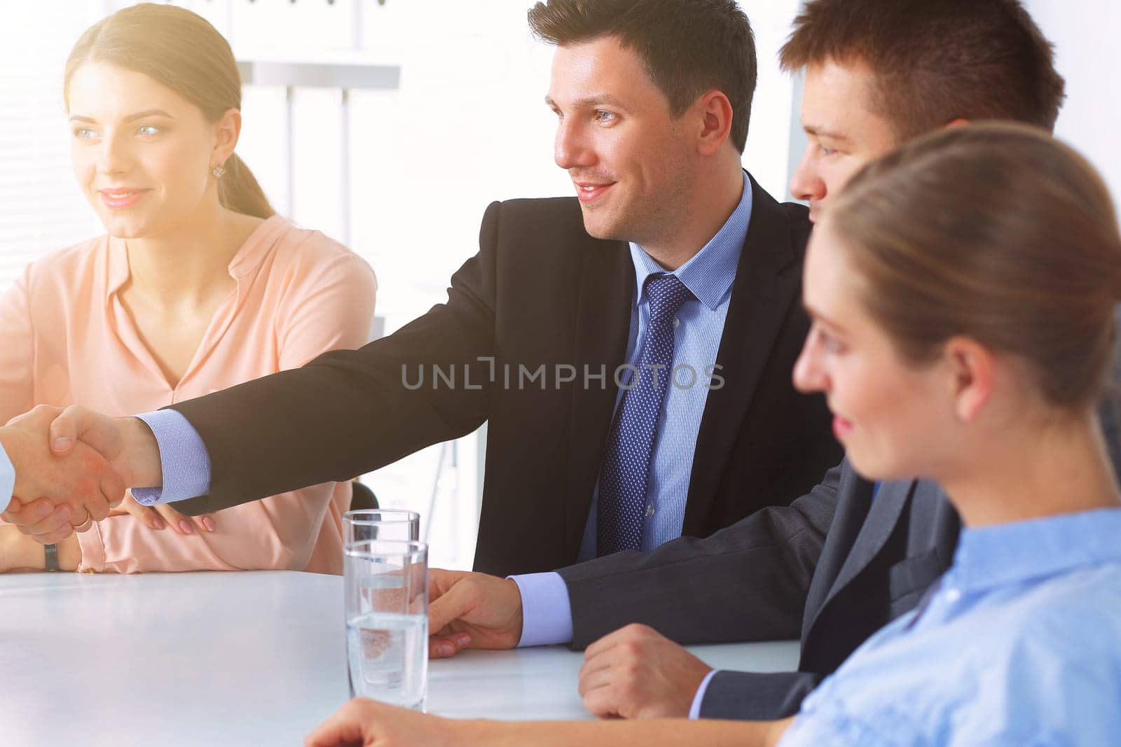 Business people sitting and discussing at business meeting