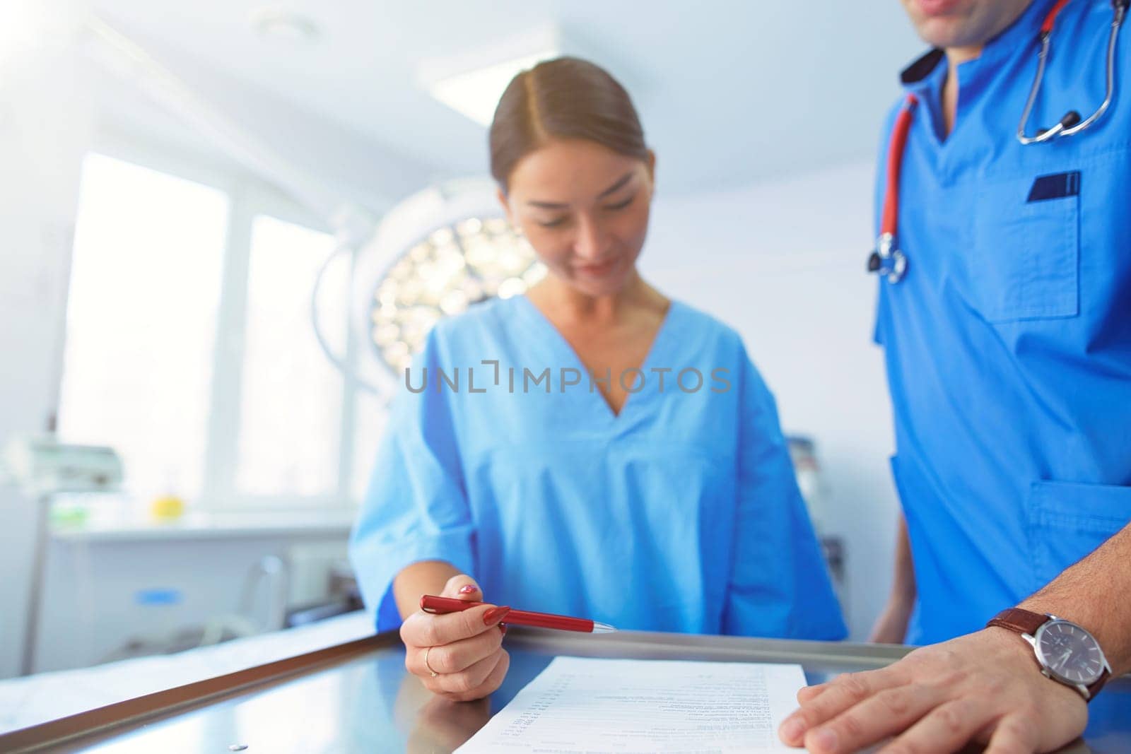 Man surgeon at work in operating room.