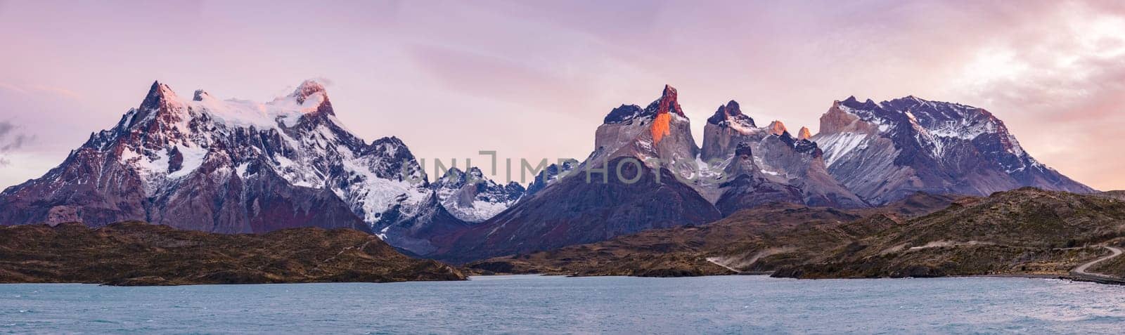 Panorama of the remarkable mountain peaks of the mountain massif at Torres del Paine National Park in the morning light, Patagonia, Chile, South America