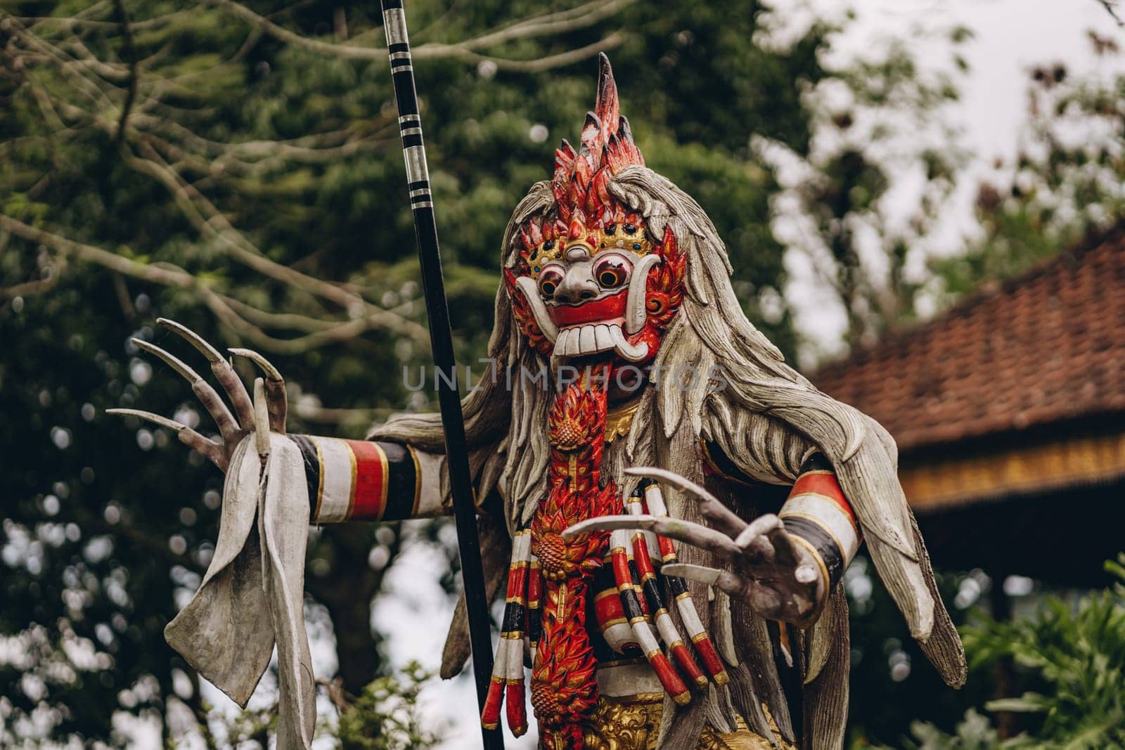 Close up of statue with barong colorful mask. Traditional balinese culture, king of spirits and souls