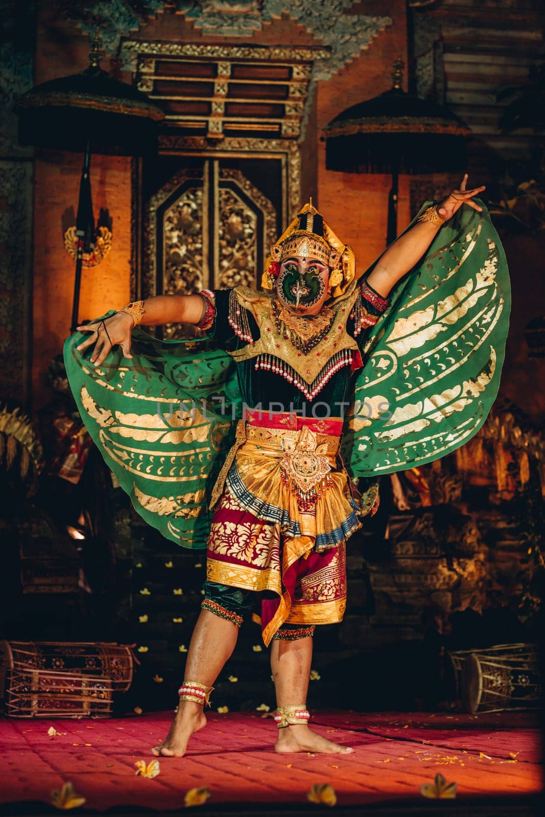 Unrecognisable Balinese artist dancing with show mask. Traditional bali cultural performance, religious dance ritual