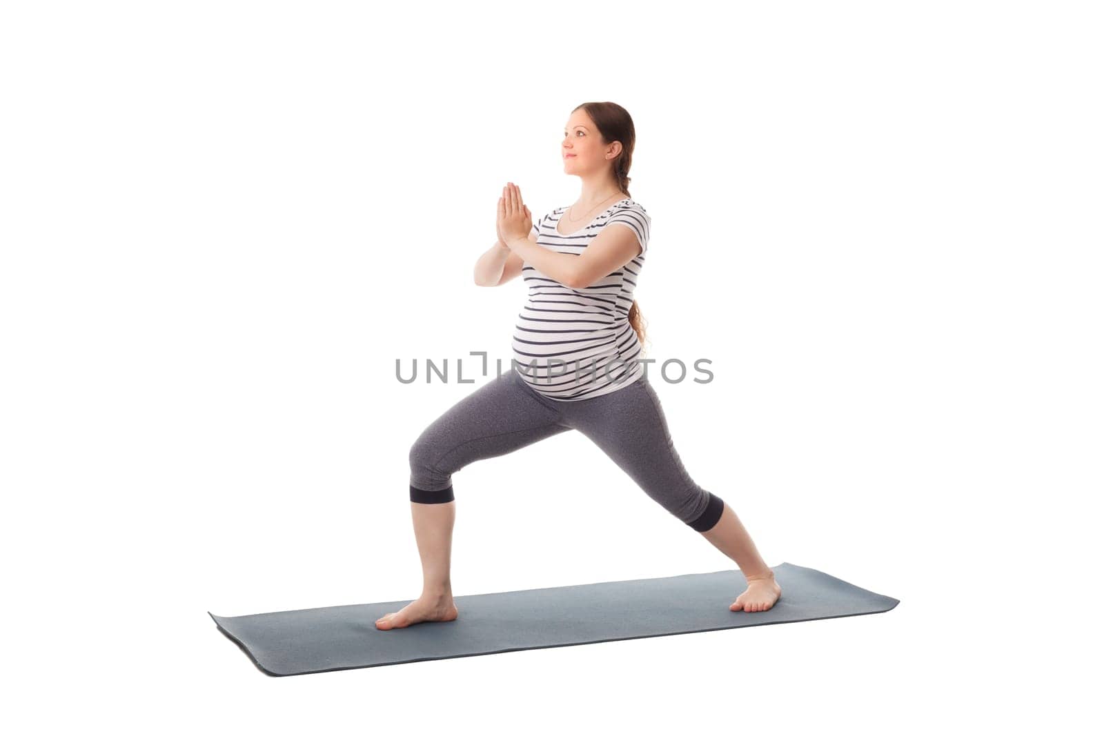 Pregnancy yoga exercise - pregnant woman doing asana virabhadrasana 1 - warrior pose isolated on white background