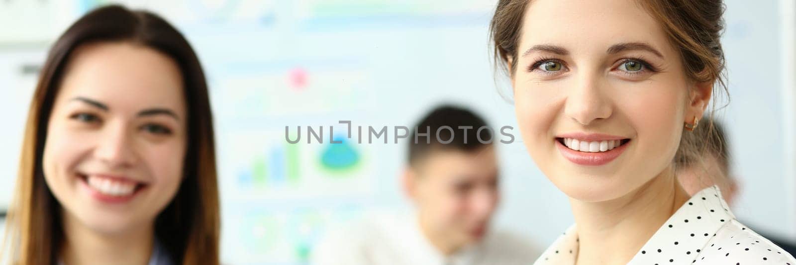 Business woman with staff and a group of people in background in modern office. Business group of people and project teamwork