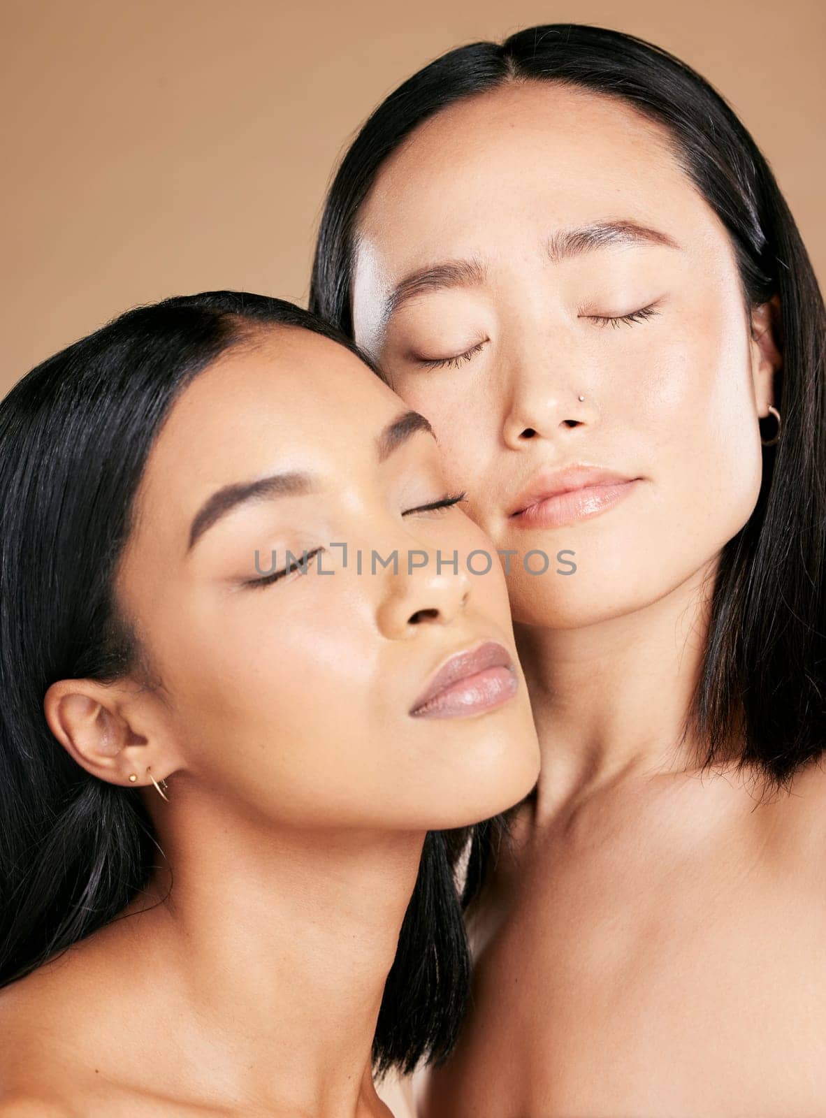Women, beauty and faces with skincare glow for diversity of skin and cosmetic self care. Facial, dermatology and spa treatment for friends or models isolated against a brown studio background.