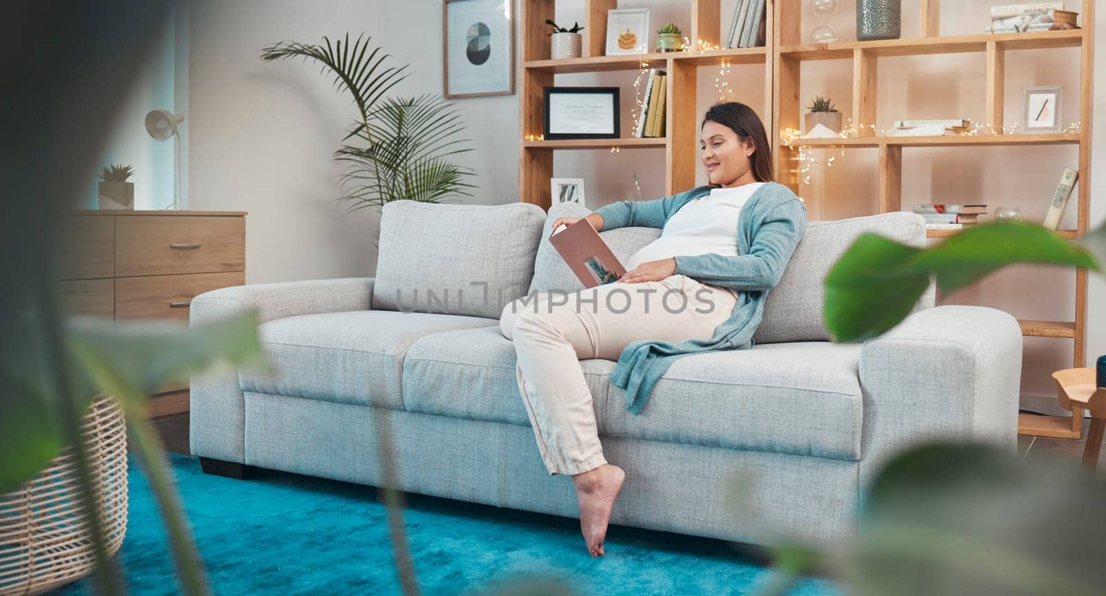 Woman, pregnant and reading a book to prepare for motherhood and being a parent at home. Woman, mom and story or novel with education information about pregnancy and maternity in the family home.