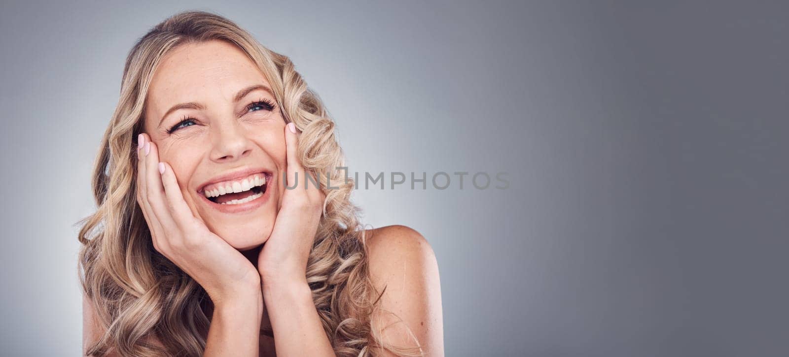 Beauty, happy and face of woman excited for cosmetics product placement, luxury makeup mockup or skincare glow. Dermatology mock up, spa studio or laughing promotion model isolated on grey background.