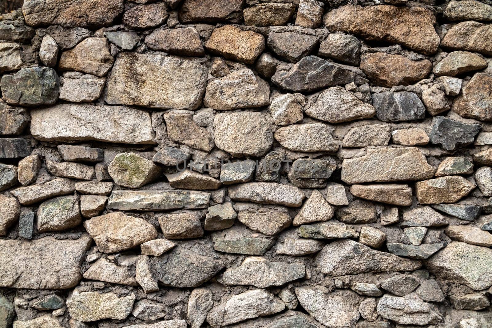 Old background of natural stones wall of different sizes by Rom4ek