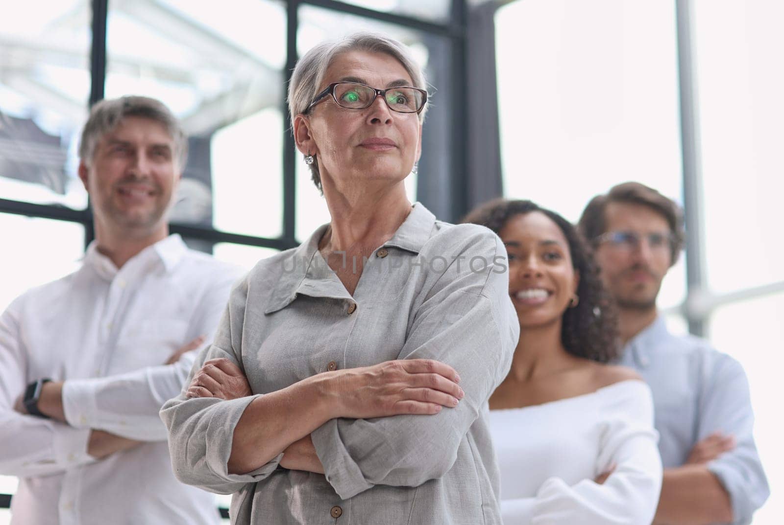 a group of pensive business people looking into the distance