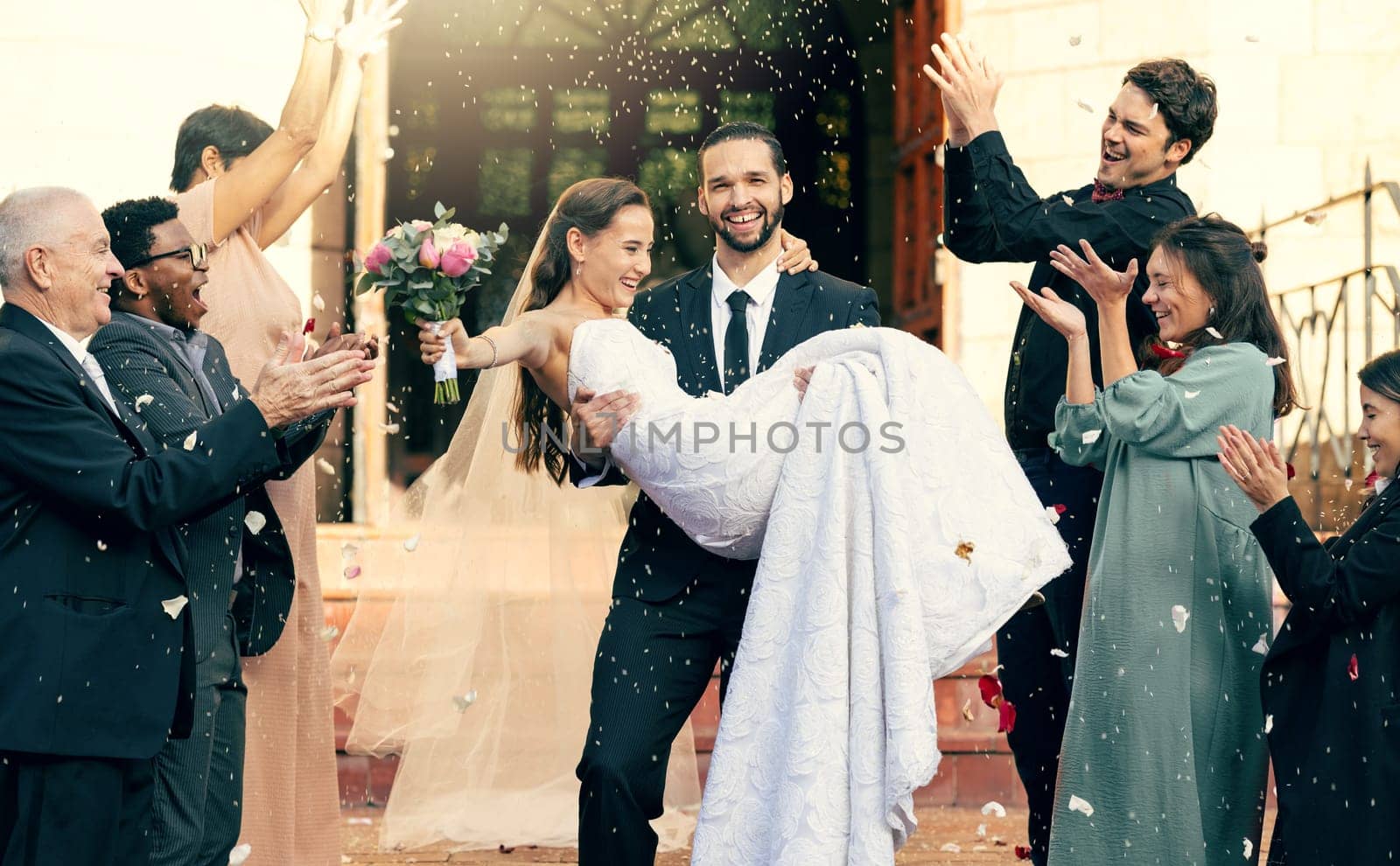 Wedding, love and man carrying woman outside church fo celebration of loving vows. Commitment and romance, romantic marriage, fun and man holding woman after love ceremony for bride and groom.