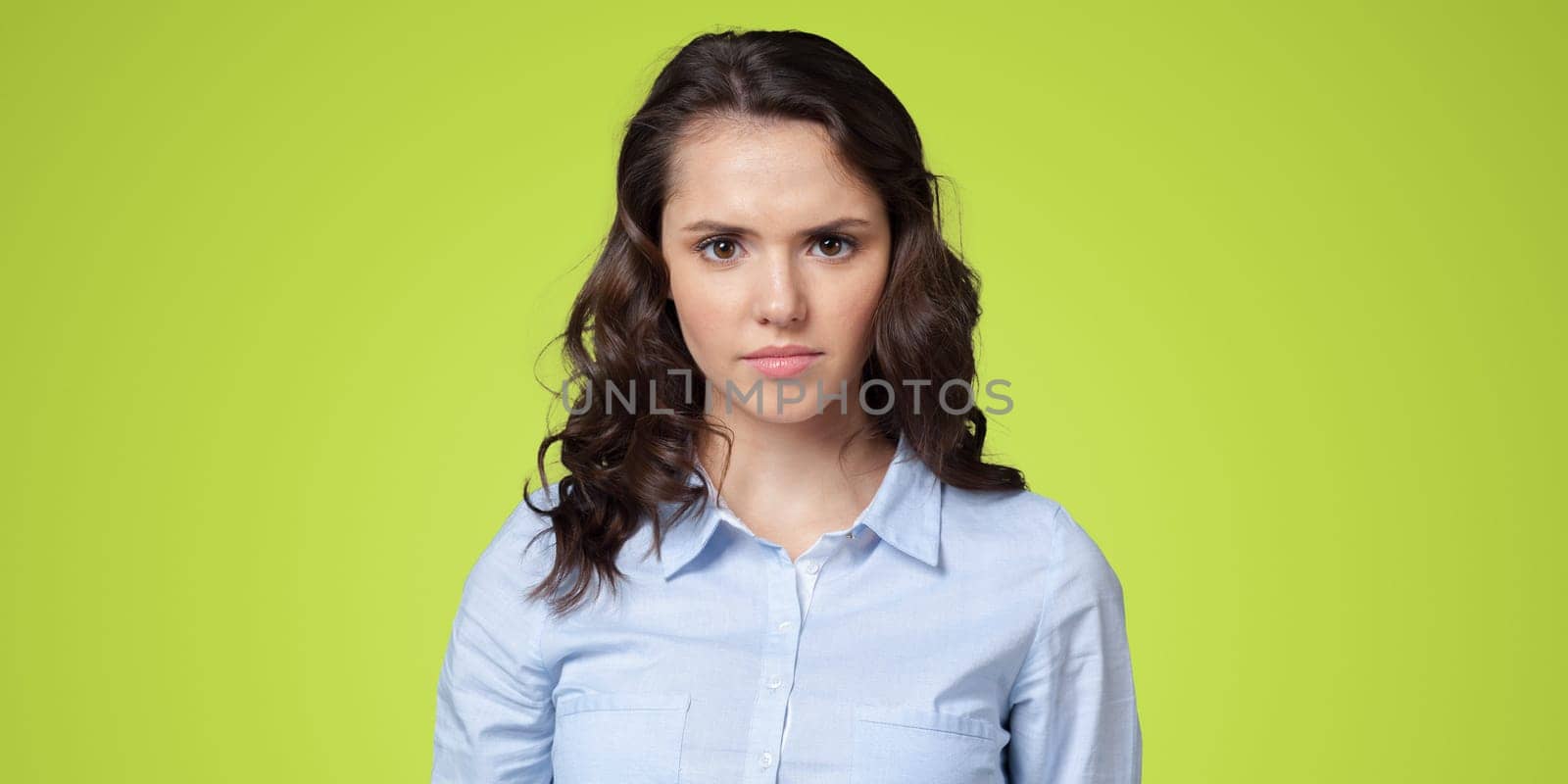 Disappointed serious cute girl woman face isolated by Fabrikasimf