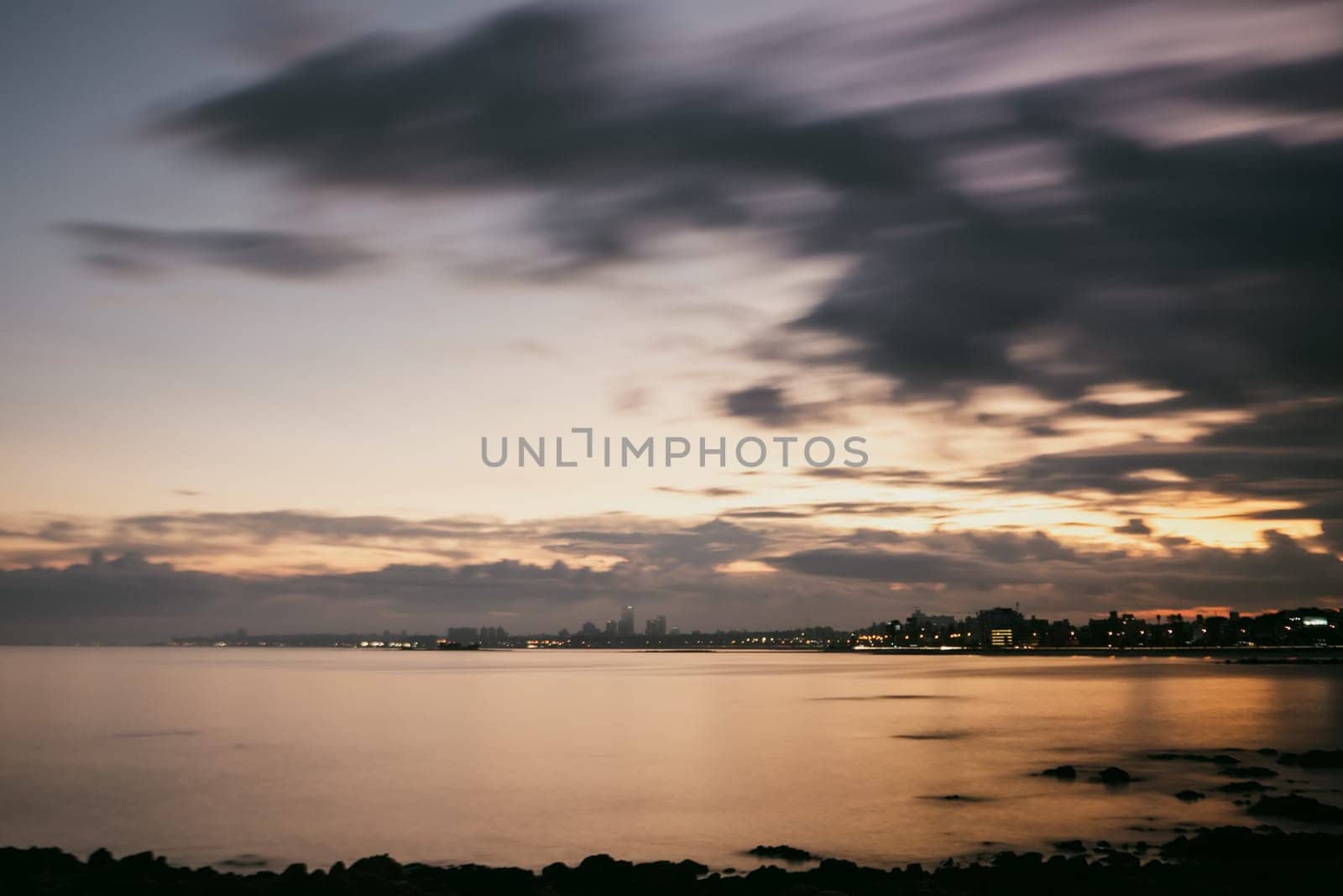 Sunset in the coastal street called Rambla in Montevideo capital of Uruguay by martinscphoto