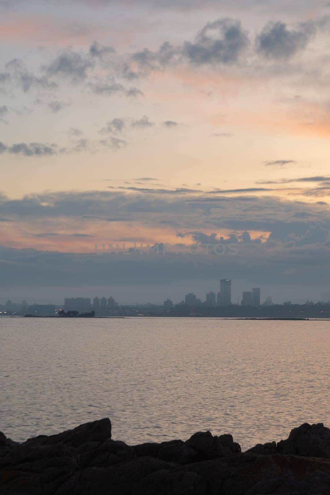 Sunset in the coastal street called Rambla in Montevideo capital of Uruguay by martinscphoto