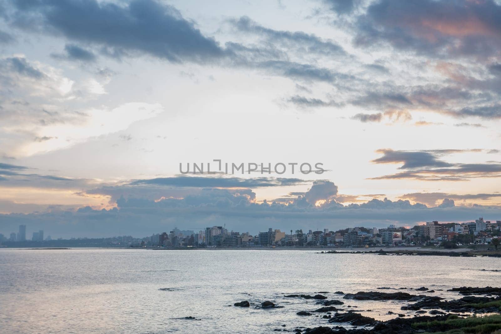 Sunset in the coastal street called Rambla in Montevideo capital of Uruguay by martinscphoto