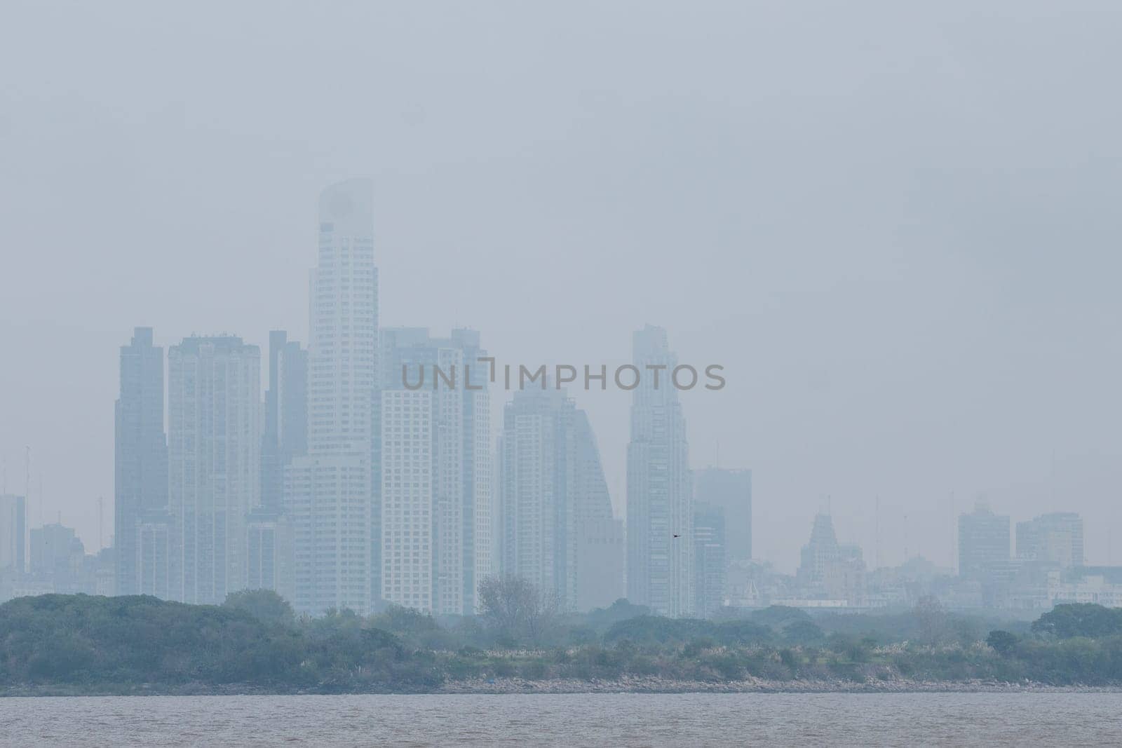 Building Silhouette On a foggy day in the port of Buenos Aires on a rainy day. by martinscphoto