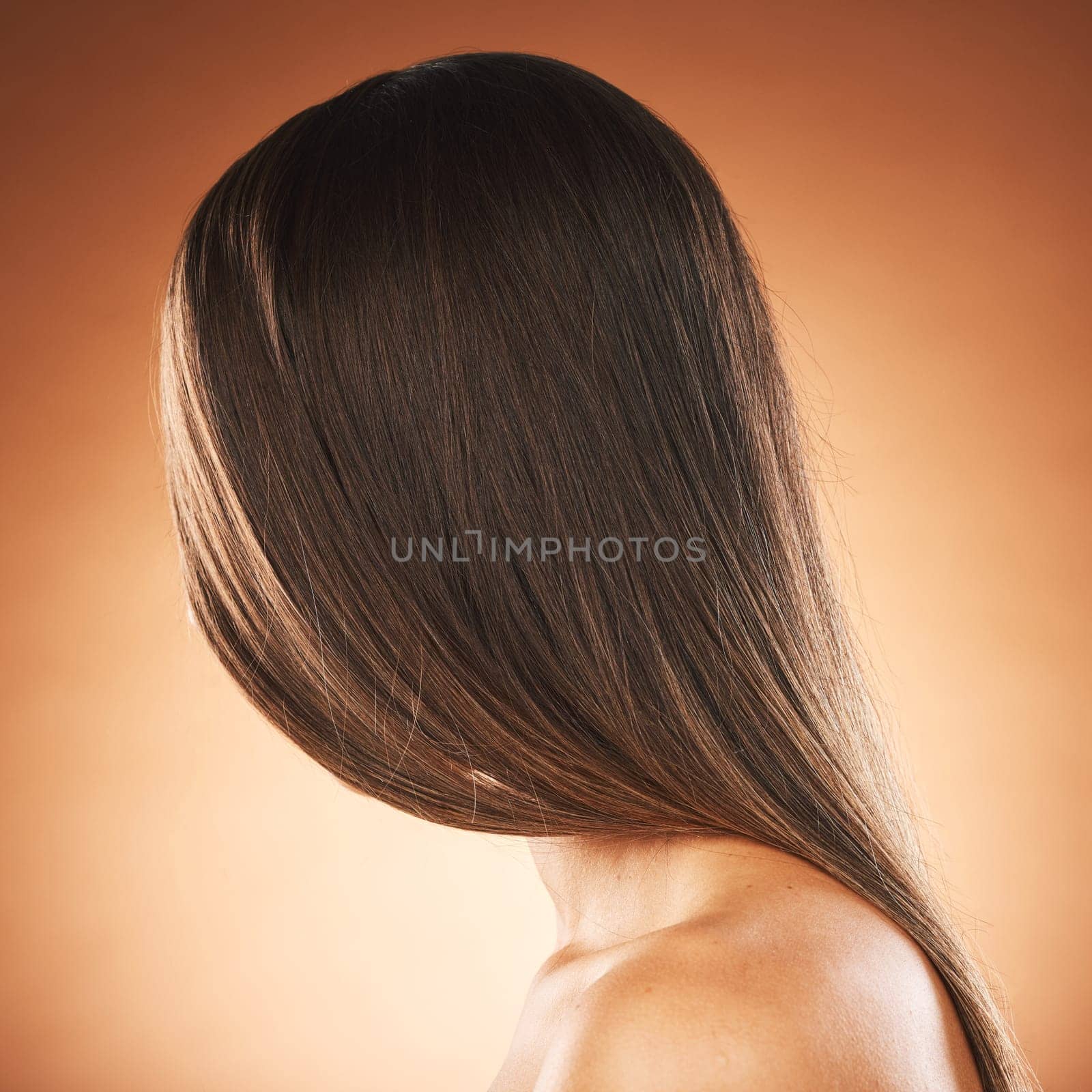 Woman, texture or hair style on orange studio background in keratin treatment marketing, Brazilian straightening advertising or self care. Model headshot, brunette color aesthetic or mockup backdrop.