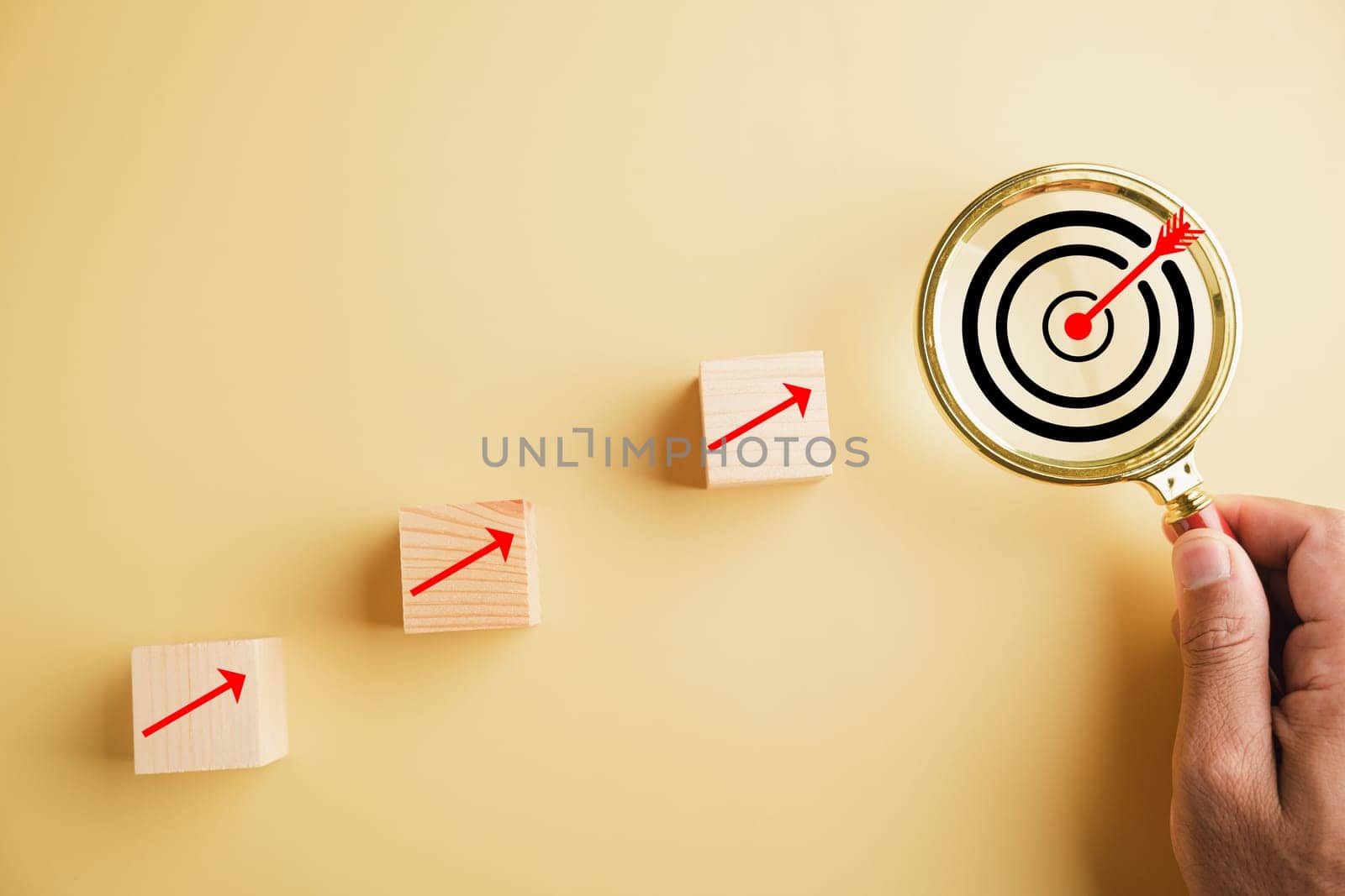 Magnifying glass focuses on a target board by Sorapop