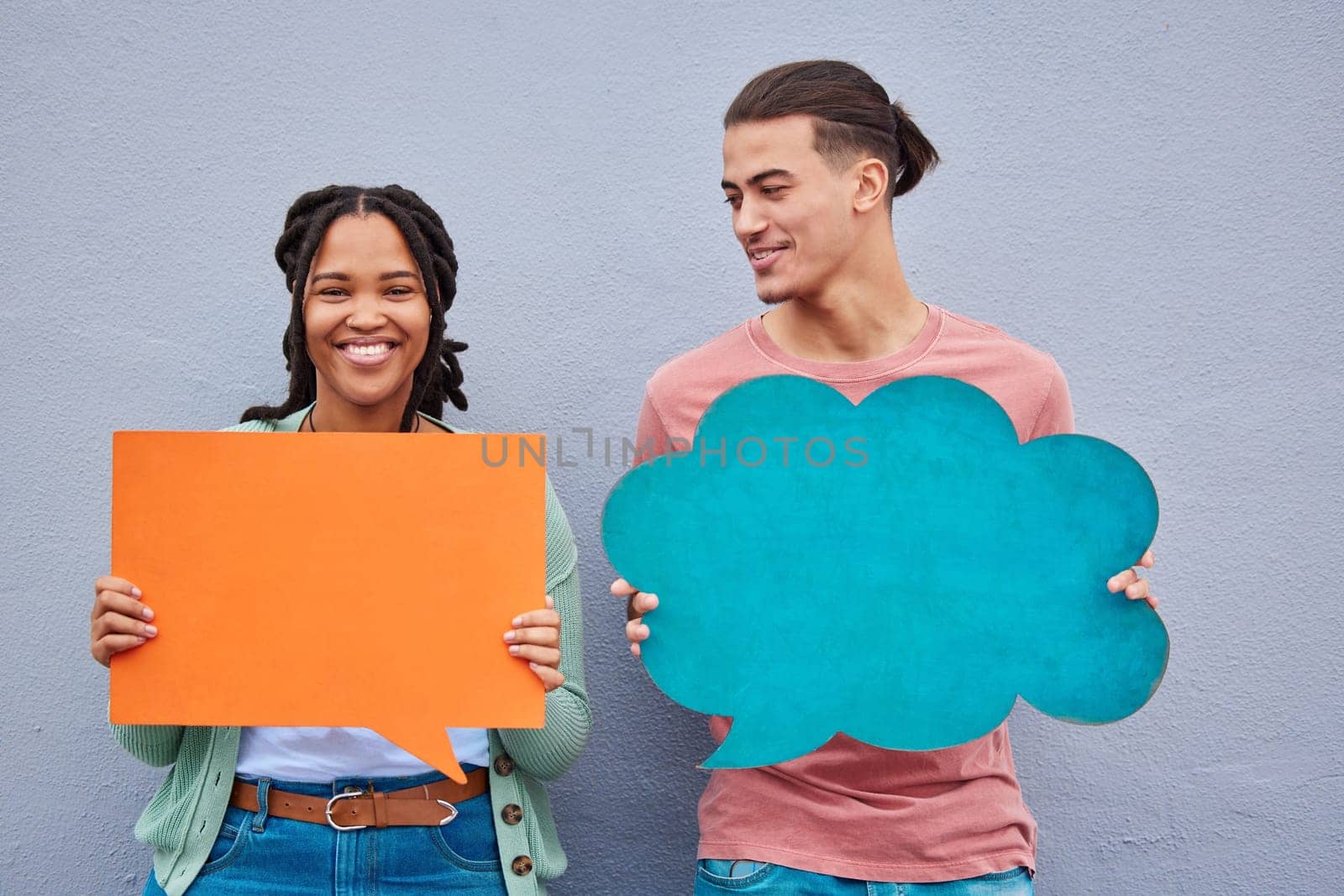 Speech bubble, diversity and couple of friends in studio for advertising, mockup and and space on grey background. Paper, banner and woman with man for social networking, communication and branding.