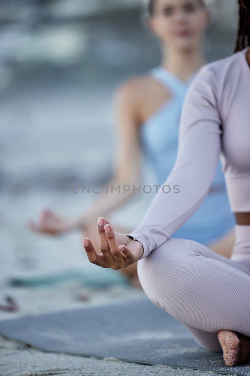 Yoga class, meditation and beach women or friends with calm, zen and peace for fitness, wellness and outdoor mental health. Diversity, spiritual and mindfulness people in pilates or meditate together by YuriArcurs