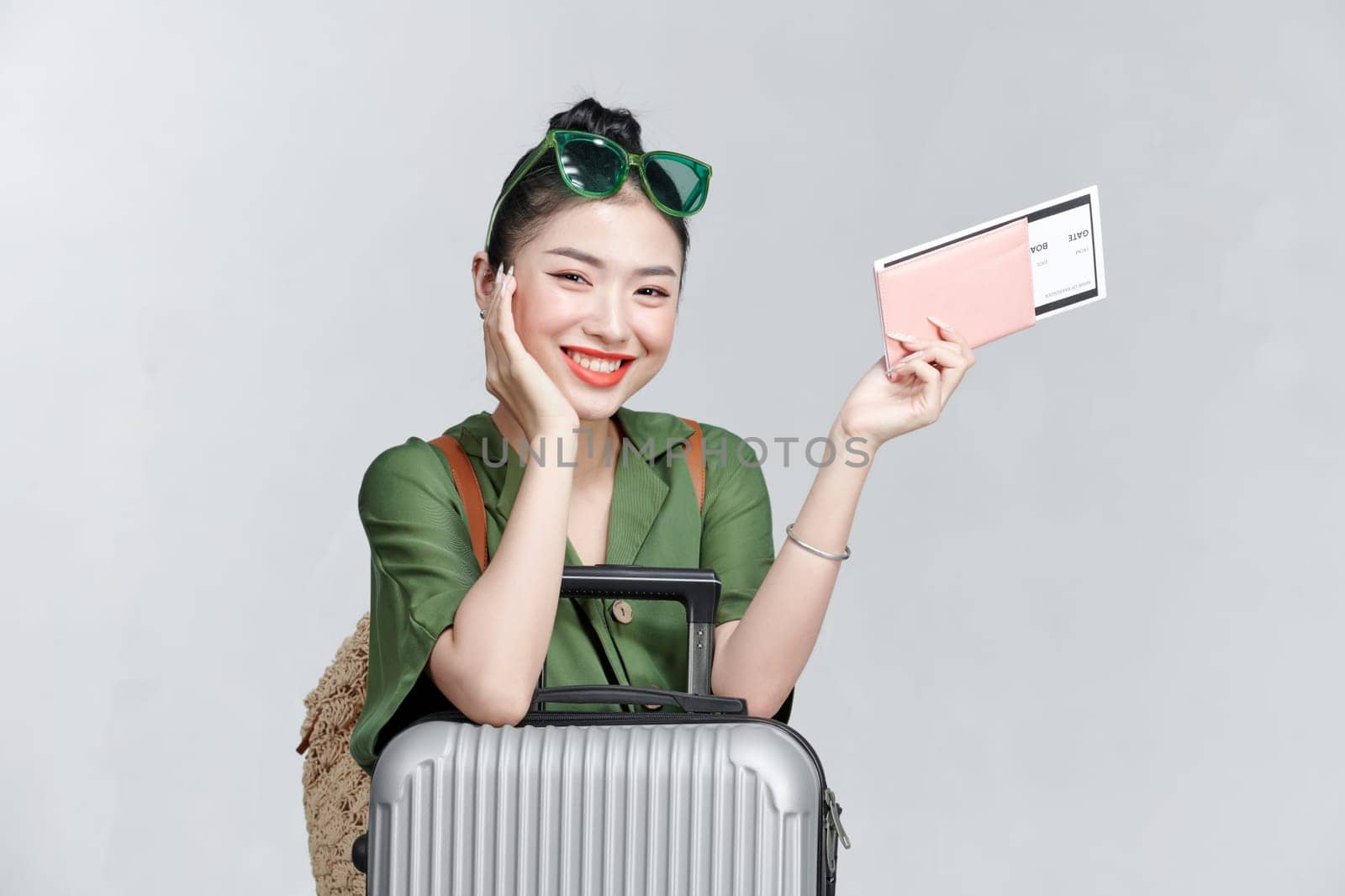 fashionable woman with suitcase passport plane tickets travel