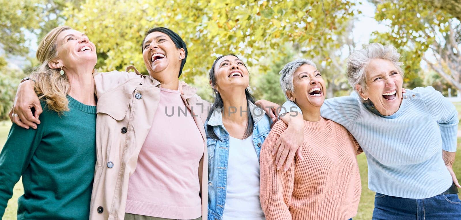 Senior people, laughing and bonding in comic joke or funny meme in nature park, spring garden or relax environment. Smile, happy women or diversity elderly friends with comedy in retirement support.