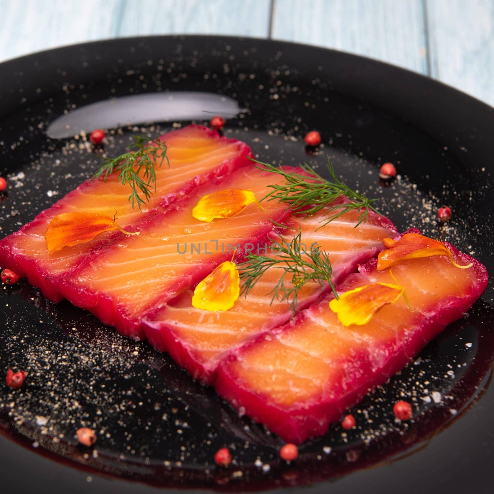 Recipe for gravlax salmon marinated with beet and avocado mayonnaise sauce. High quality photo