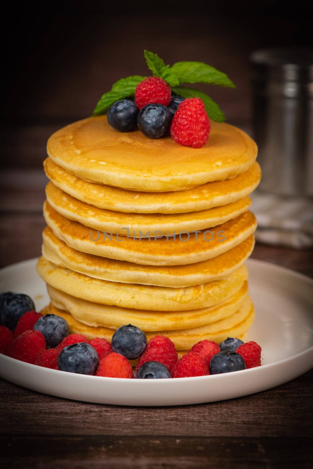 Recipe for maple syrup pancakes with raspberry and blueberry filling, High quality photo