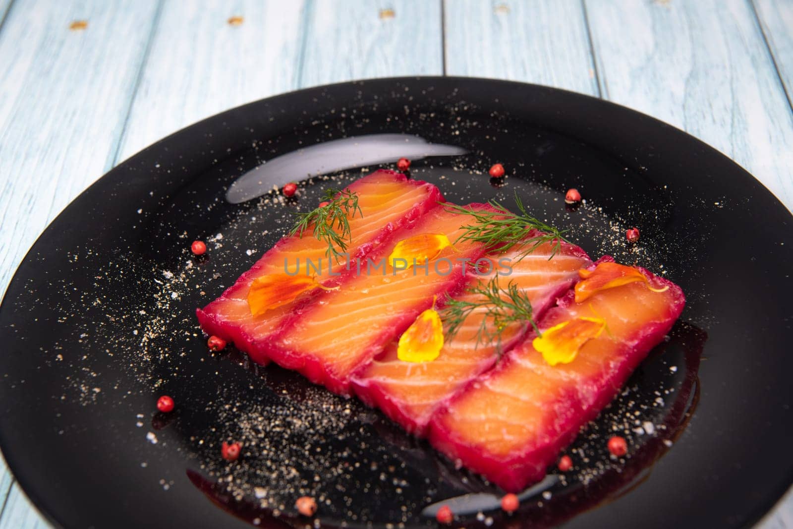 Recipe for gravlax salmon marinated with beet and avocado mayonnaise sauce. High quality photo