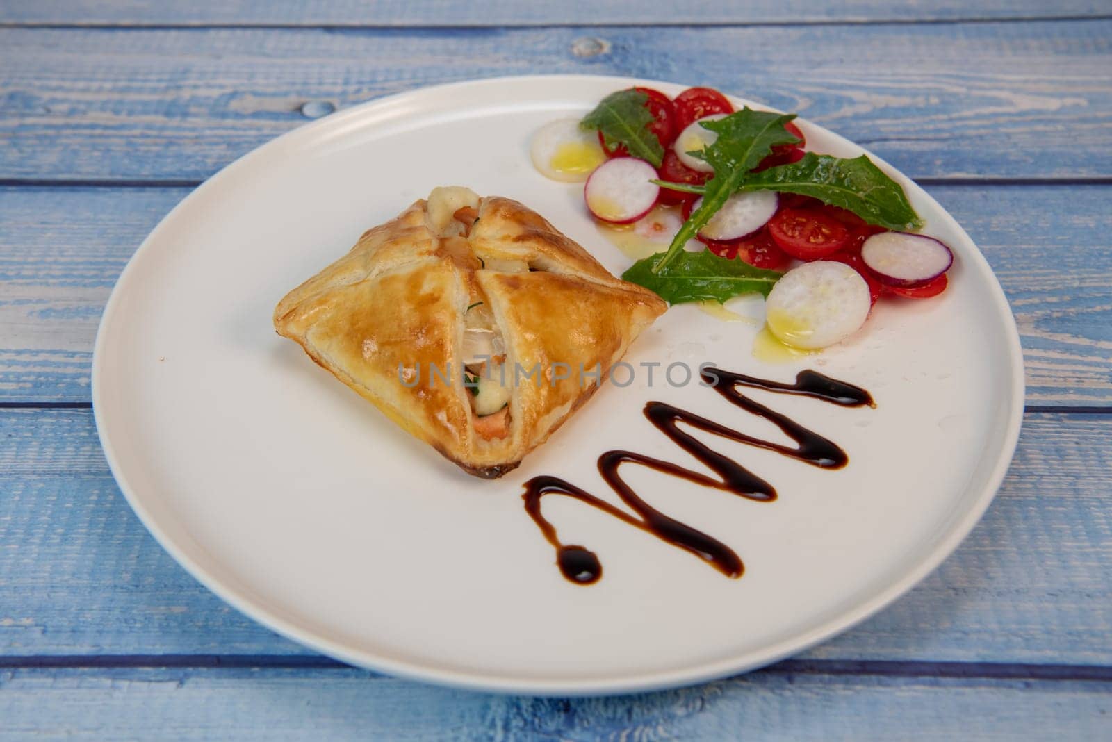 Salmon and goat cheese puff pastry recipe. High quality photo