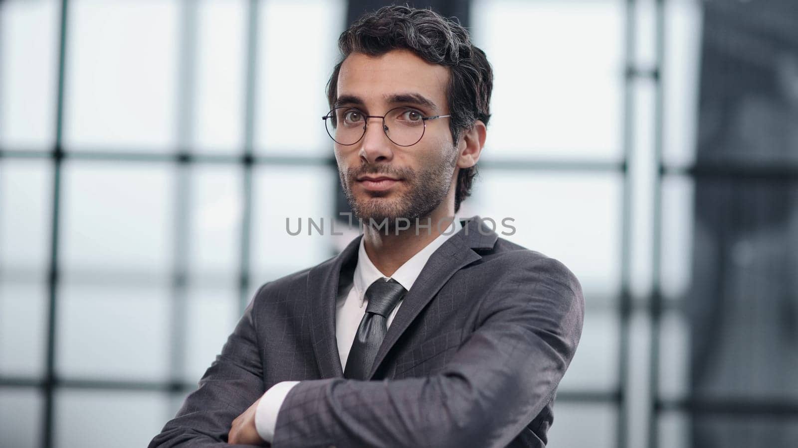 Handsome business CEO executive business man with crossed arms