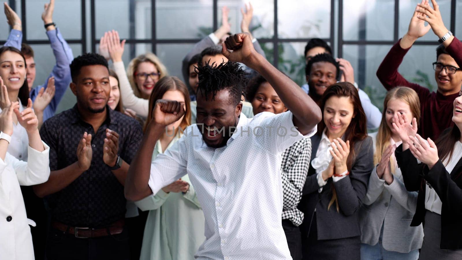 Portrait of business and advertising team, laughing and clapping
