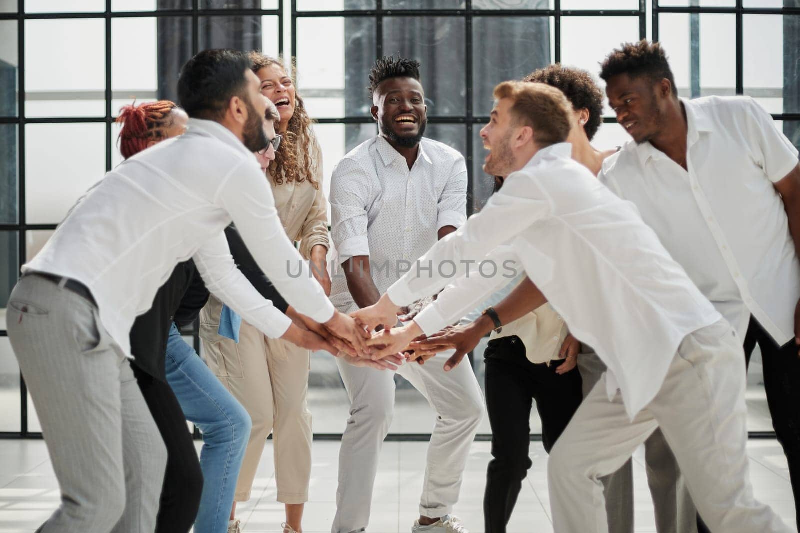 Teamwork and team spirit ,handshake in a group after work succe