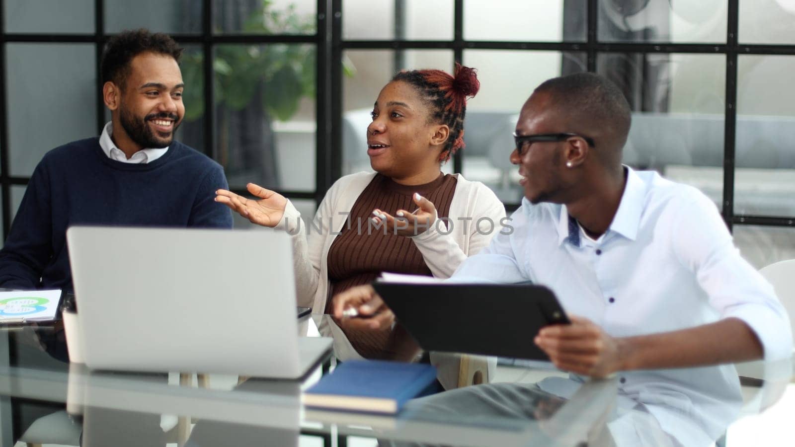 Business team in an office smiling at the camera